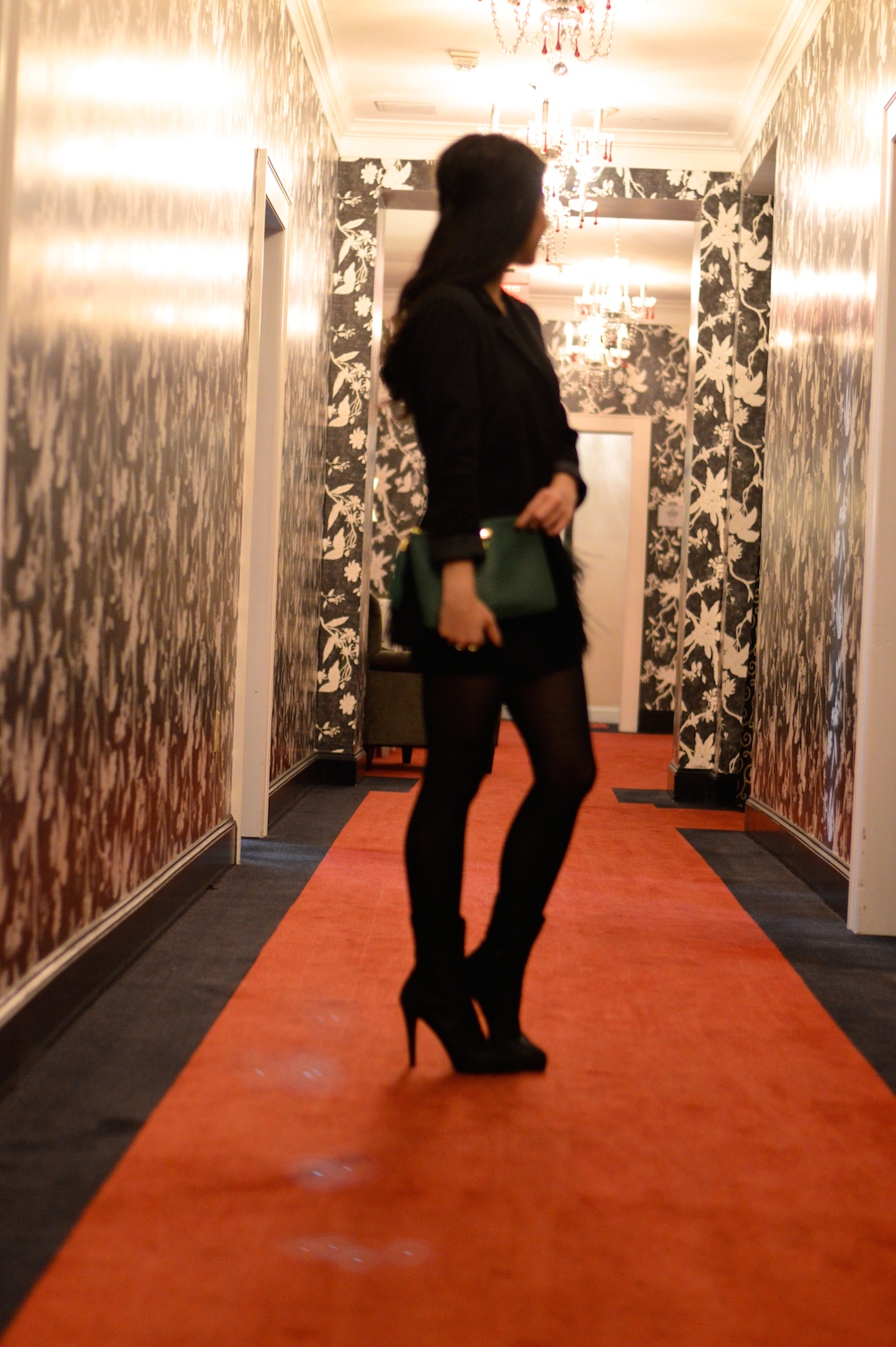 black outfit green clutch