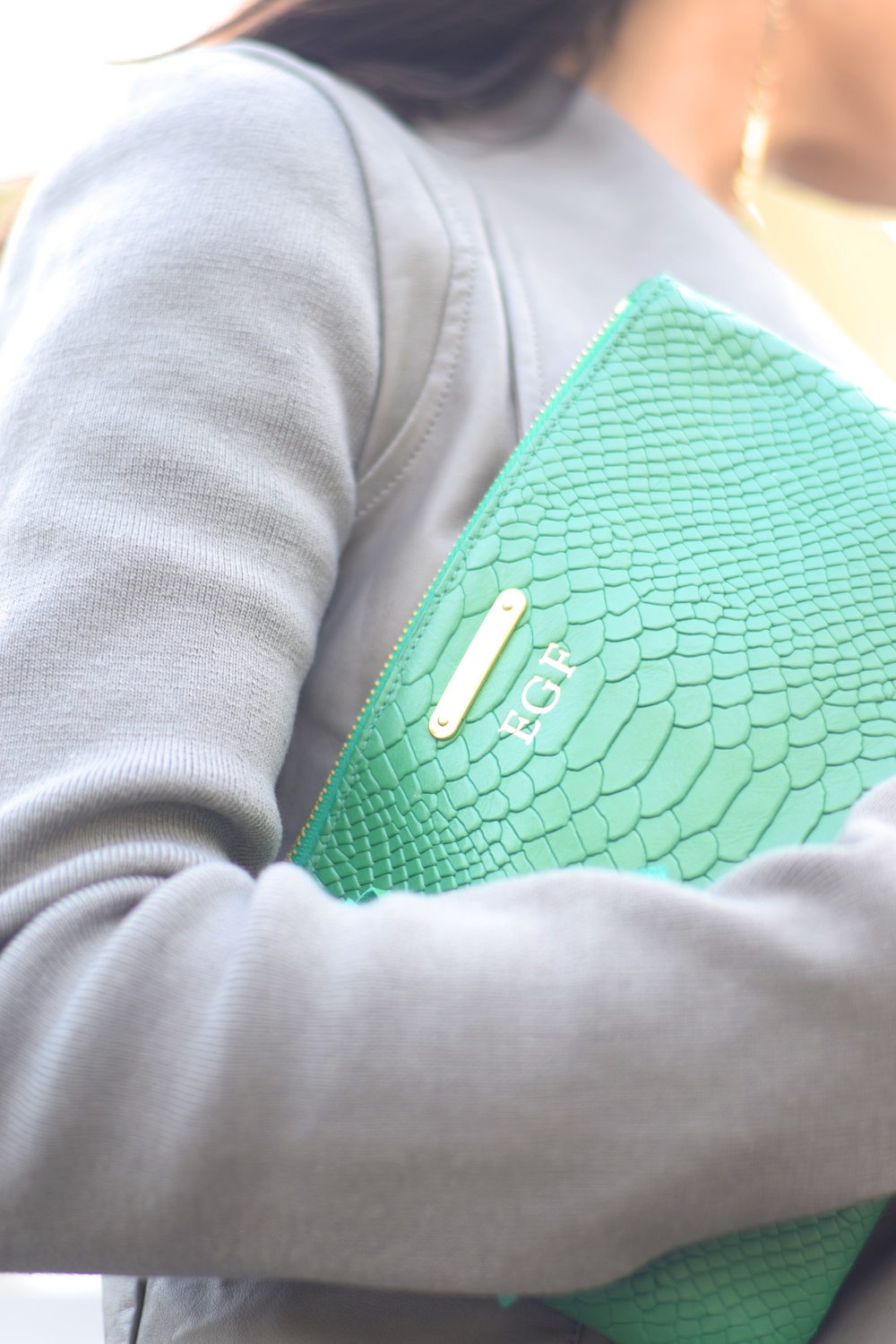 monogram green gigi clutch