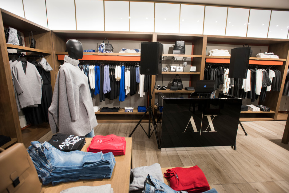 Guests enjoy the opening of the new Armani Exchange in Dallas, Texas on September 24, 2015.