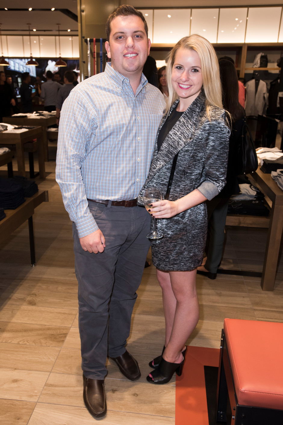 Kevin Lazares and Janie Flowers pose for a photo at the Armani Exchange in Dallas, Texas on September 24, 2015.