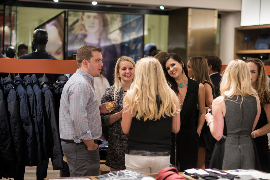 Guests enjoy the opening of the new Armani Exchange in Dallas, Texas on September 24, 2015.