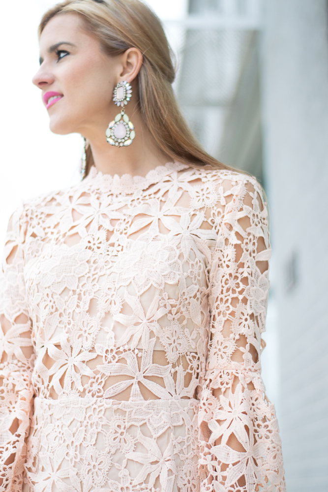 blush lace dress and statement earrings