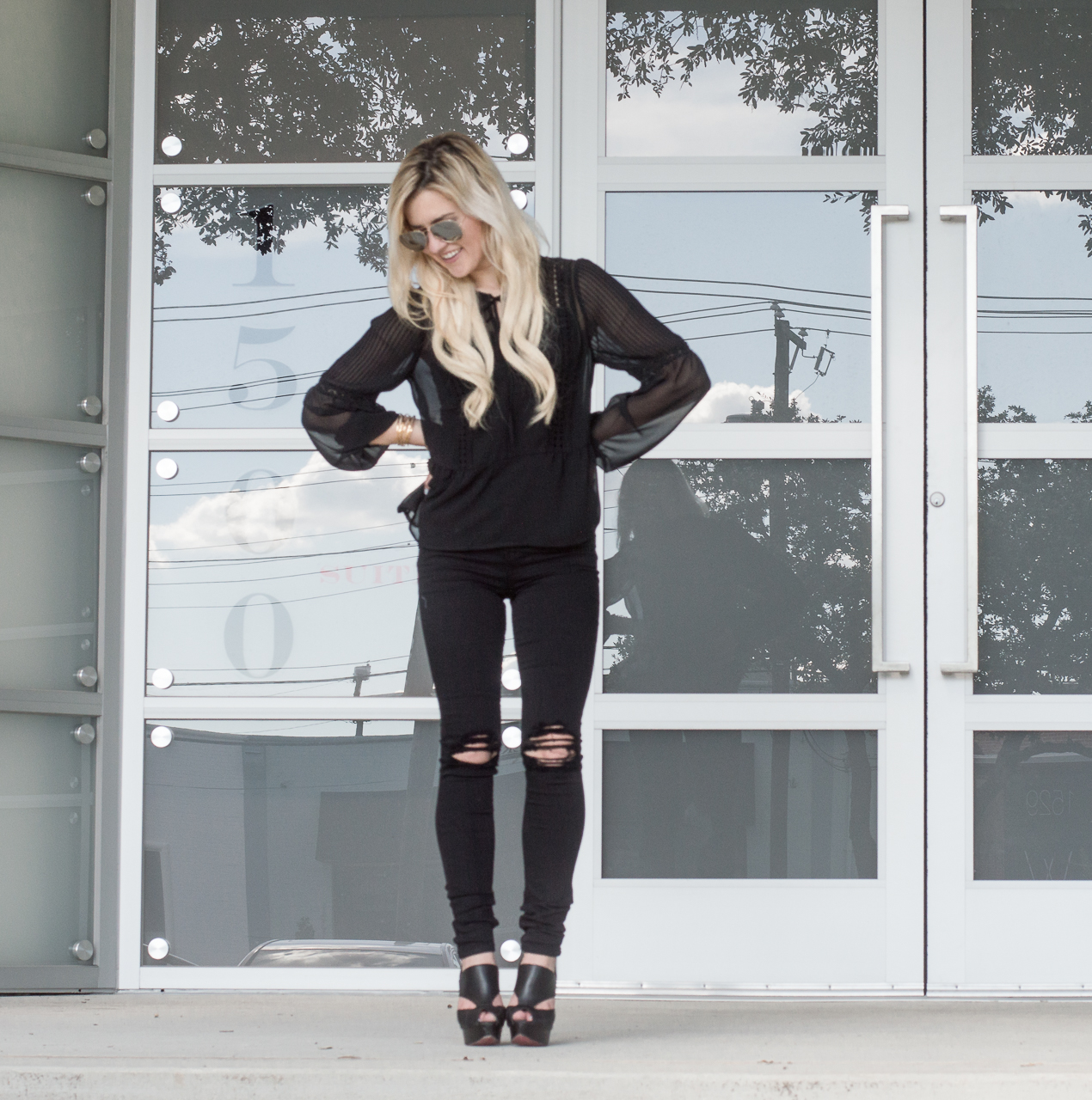 black top ripped jeans