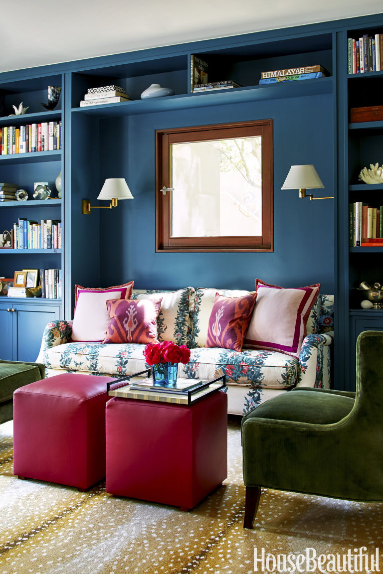 blue-bookshelf-floral-couch-pink-antelope-rug