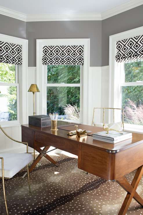 vintage-campaign-desk-antelope-rug-gold-chairs-office-vertical-wall-panels