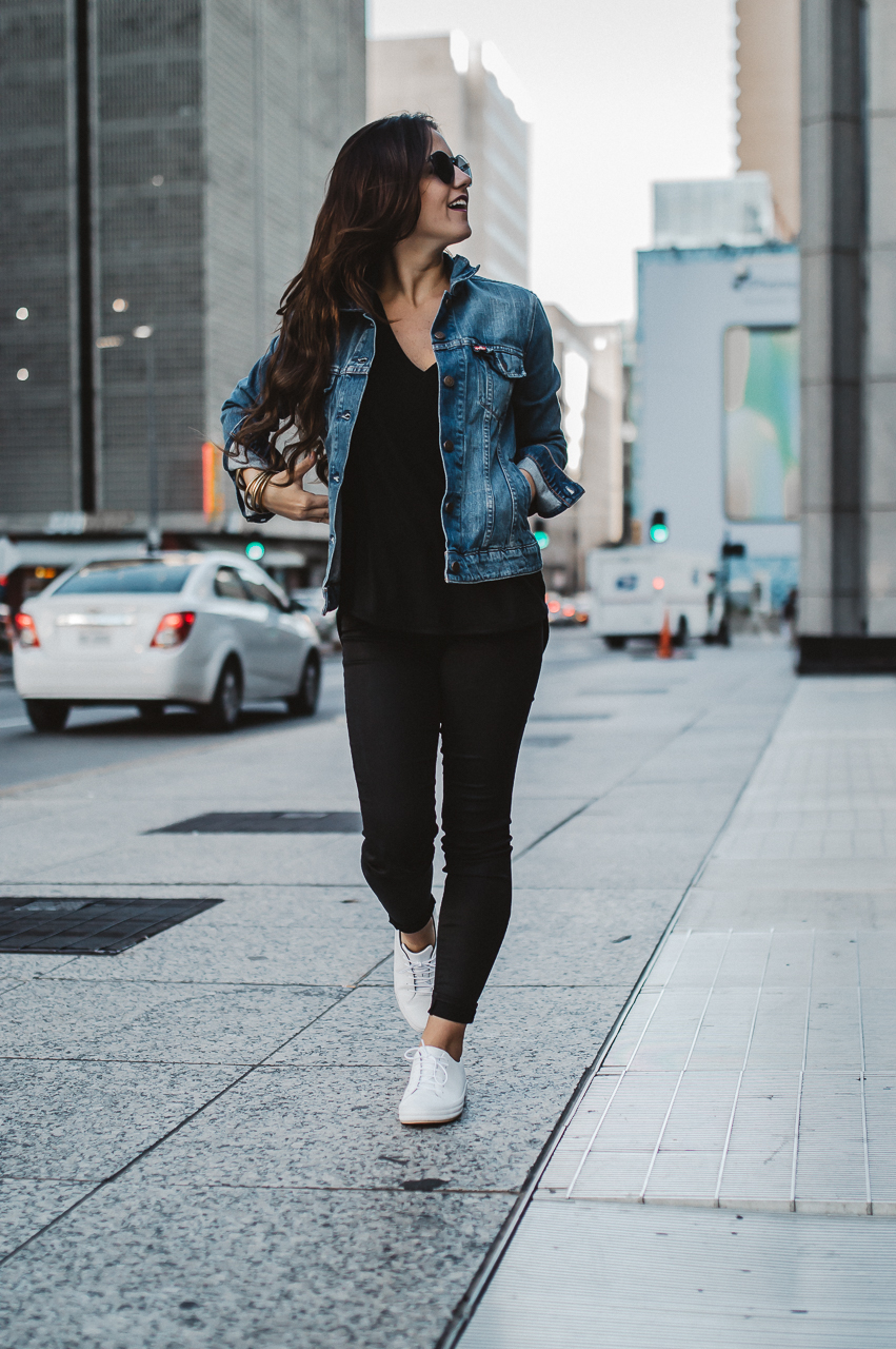 dress with denim jacket and sneakers